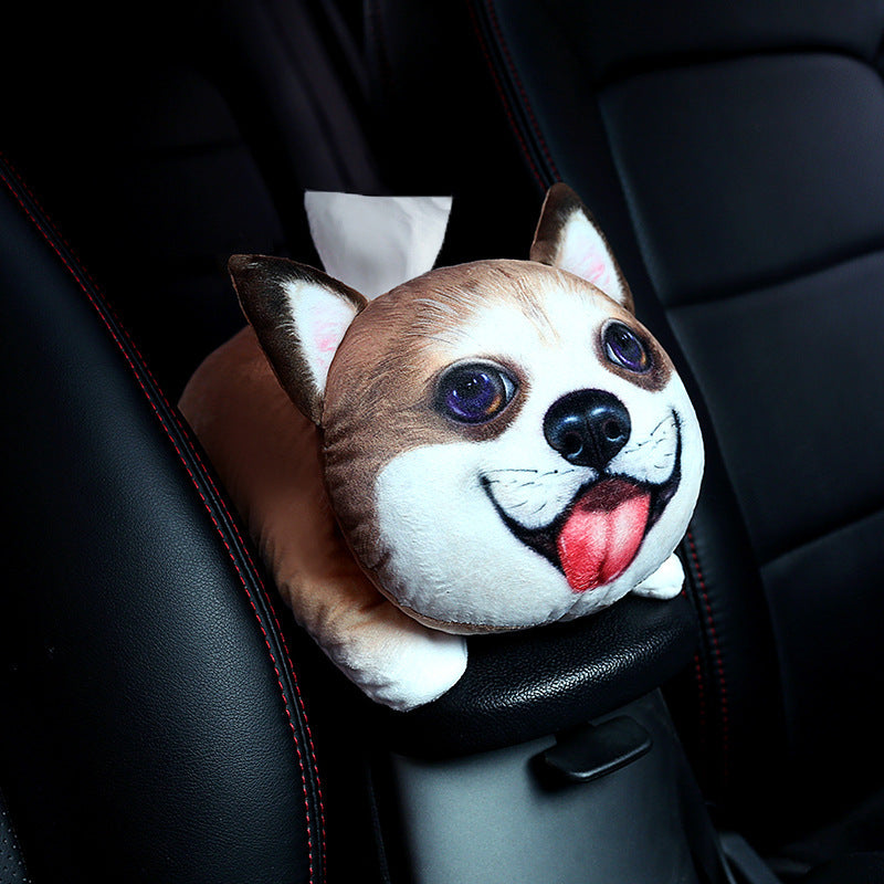 Car tissue holder shaped like a dog's face on a car seat.